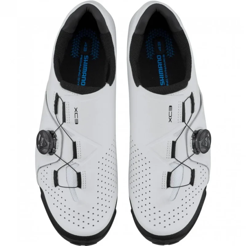 White Shimano XC3 MTB cycling shoes with BOA closure system, top view.