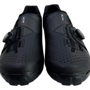Black Shimano XC-3 MTB cycling shoes. "XC3" text is visible on the shoes.