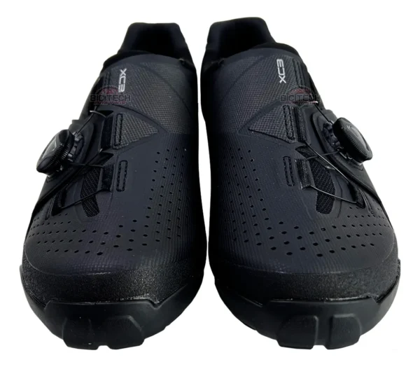Black Shimano XC-3 MTB cycling shoes. "XC3" text is visible on the shoes.