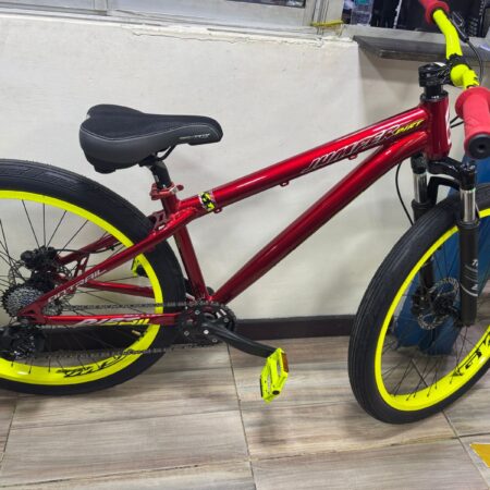 Red ON TRAIL JUMPER STUNT bike with yellow rims, handlebars, and pedals.