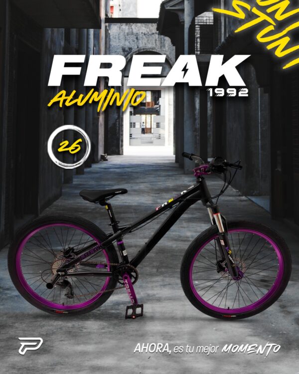Black PROFIT FREAK stunt bicycle with purple rims and accents, parked in an alleyway. "FREAK ALUMINIO" text visible.